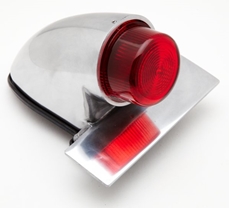 Picture of Replica polished alloy Sparto rear lamp with integral number plate mount and projected lens.